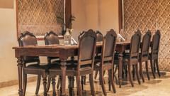 Image of table and chairs arranged neatly in a dining space